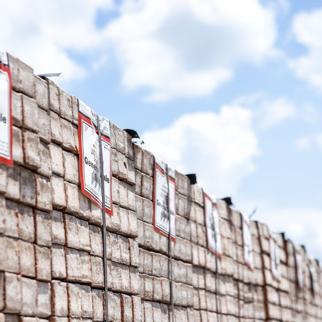Brick Cubes lined up in order on a sunny day.